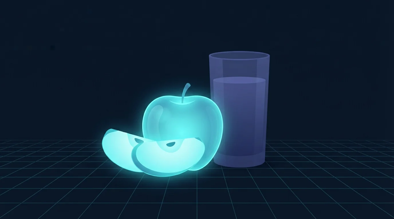 A whole sliced apple glowing beside a tall glass of pressed juice, the apple lit brightly and the glass left dim, showing that whole fruit and juice behave differently