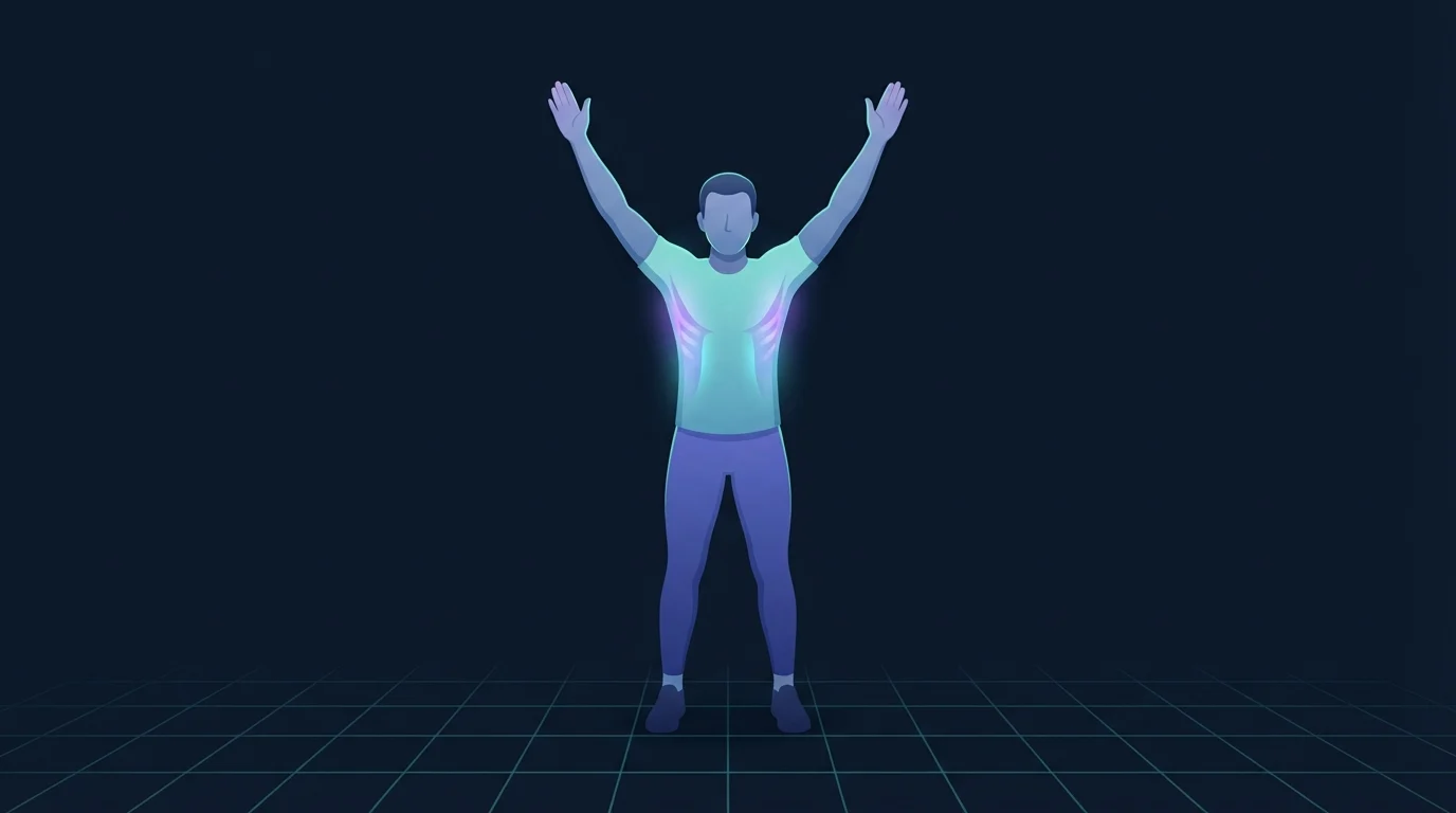 A person standing with arms raised overhead in a wide V against a wall, the muscles between and below the shoulder blades glowing